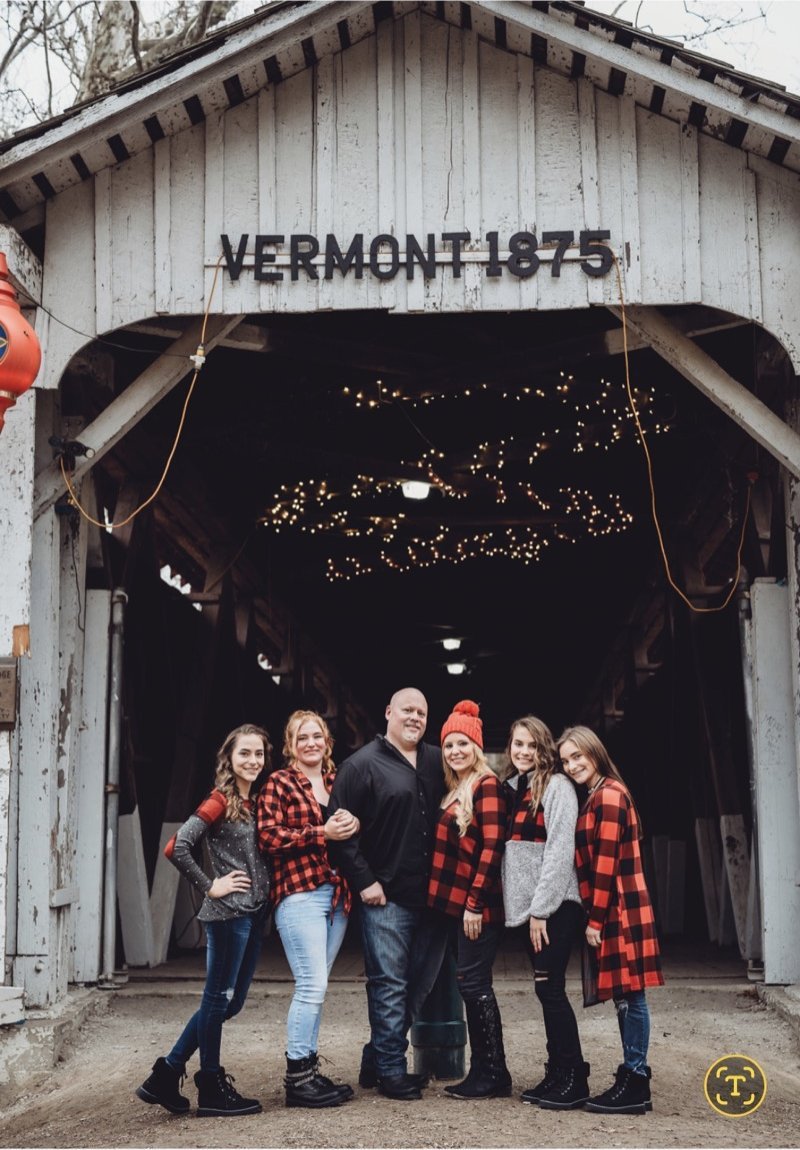 Scott Howell family photo at a Vermont covered bridge